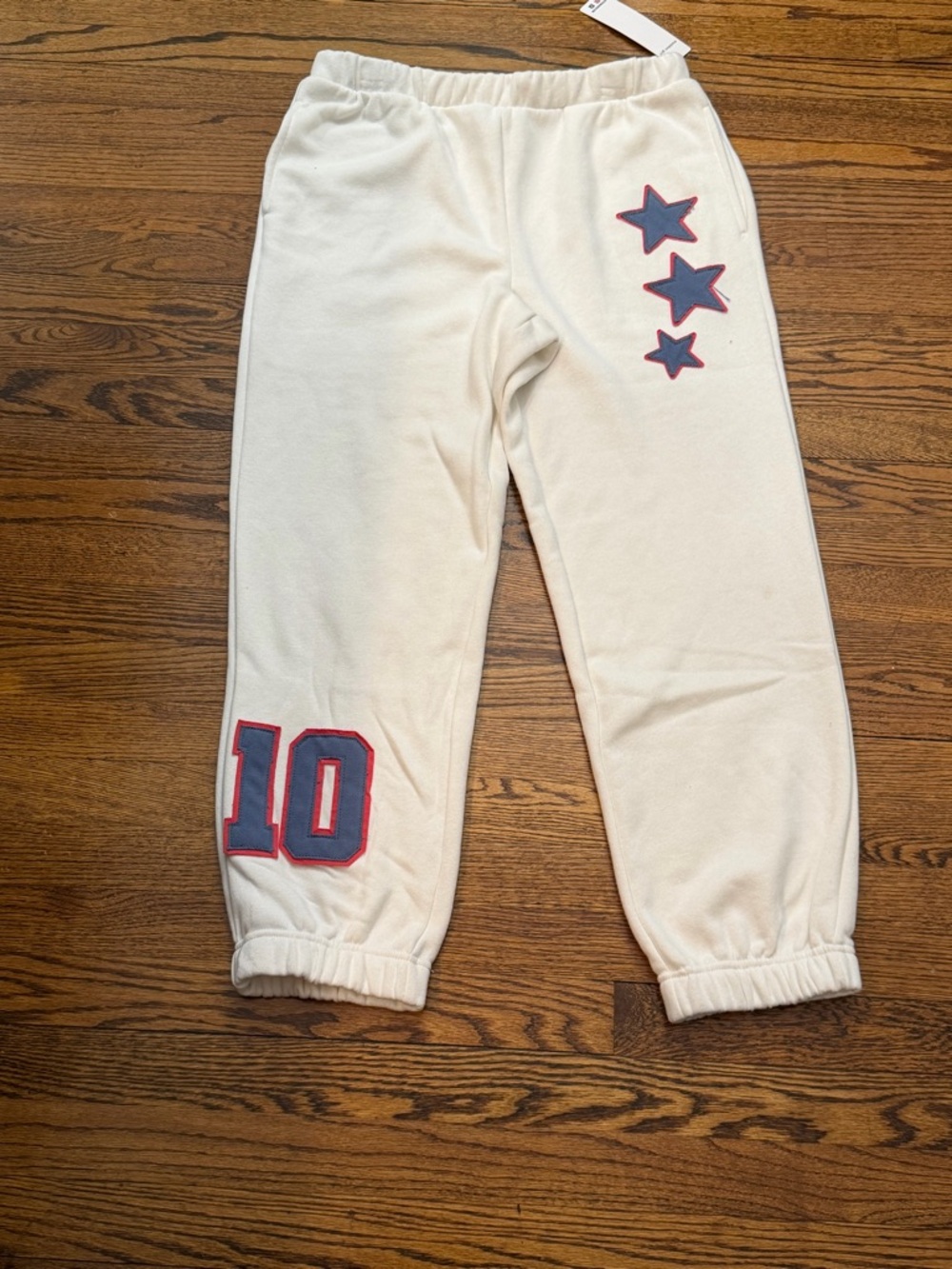 Madden Girl Cream Joggers with Blue Star & Number Accents